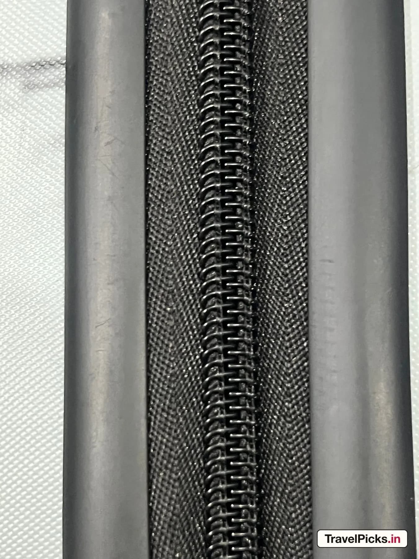 Macro view of the main zip chain running between its two moulded shell lips.